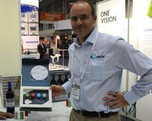 Amcor's Andres del Solar shows off the company's expanded Stelvin wine cap liner range at WineTech in Sydney.